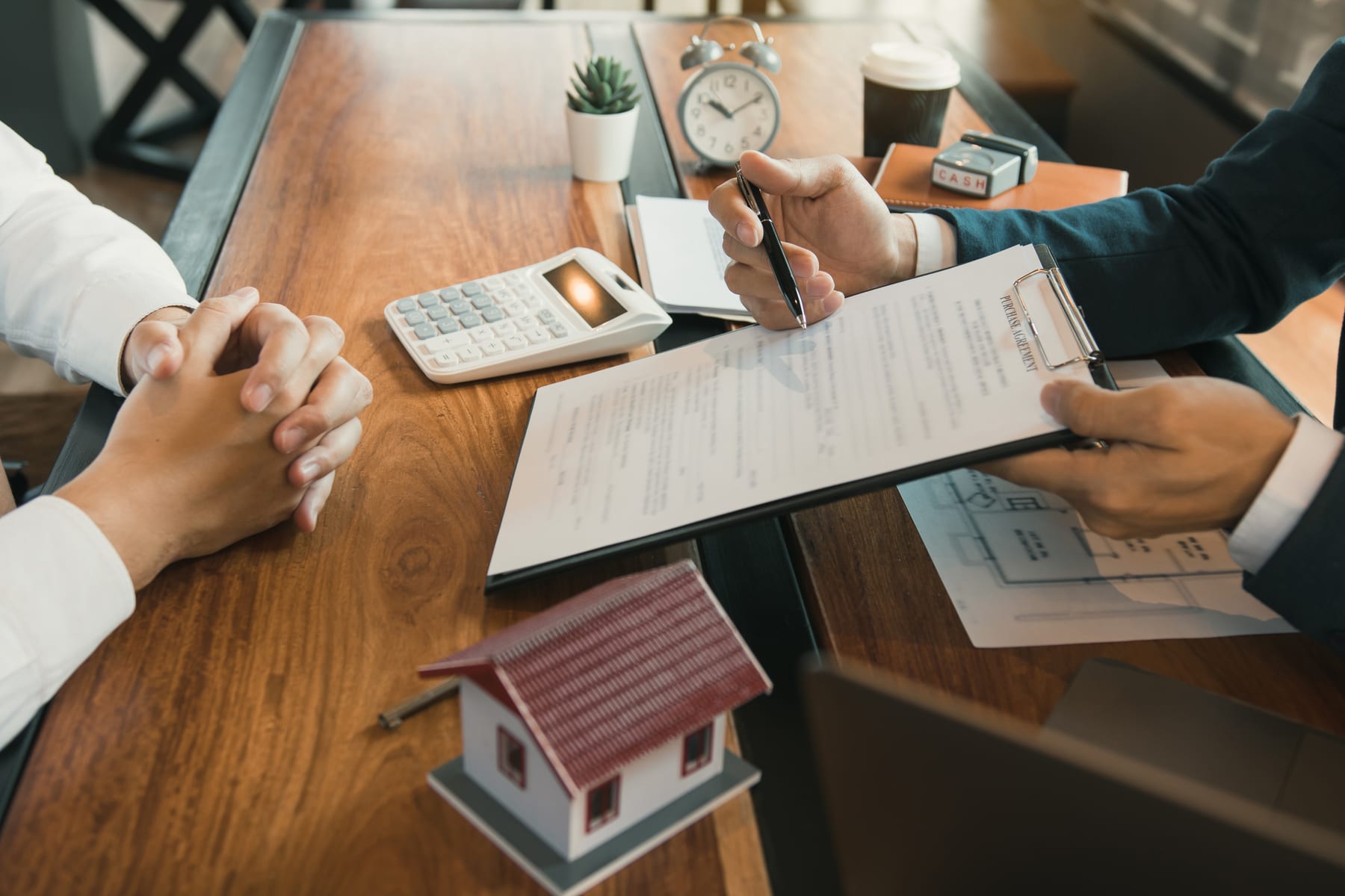 agent reviewing contract house model